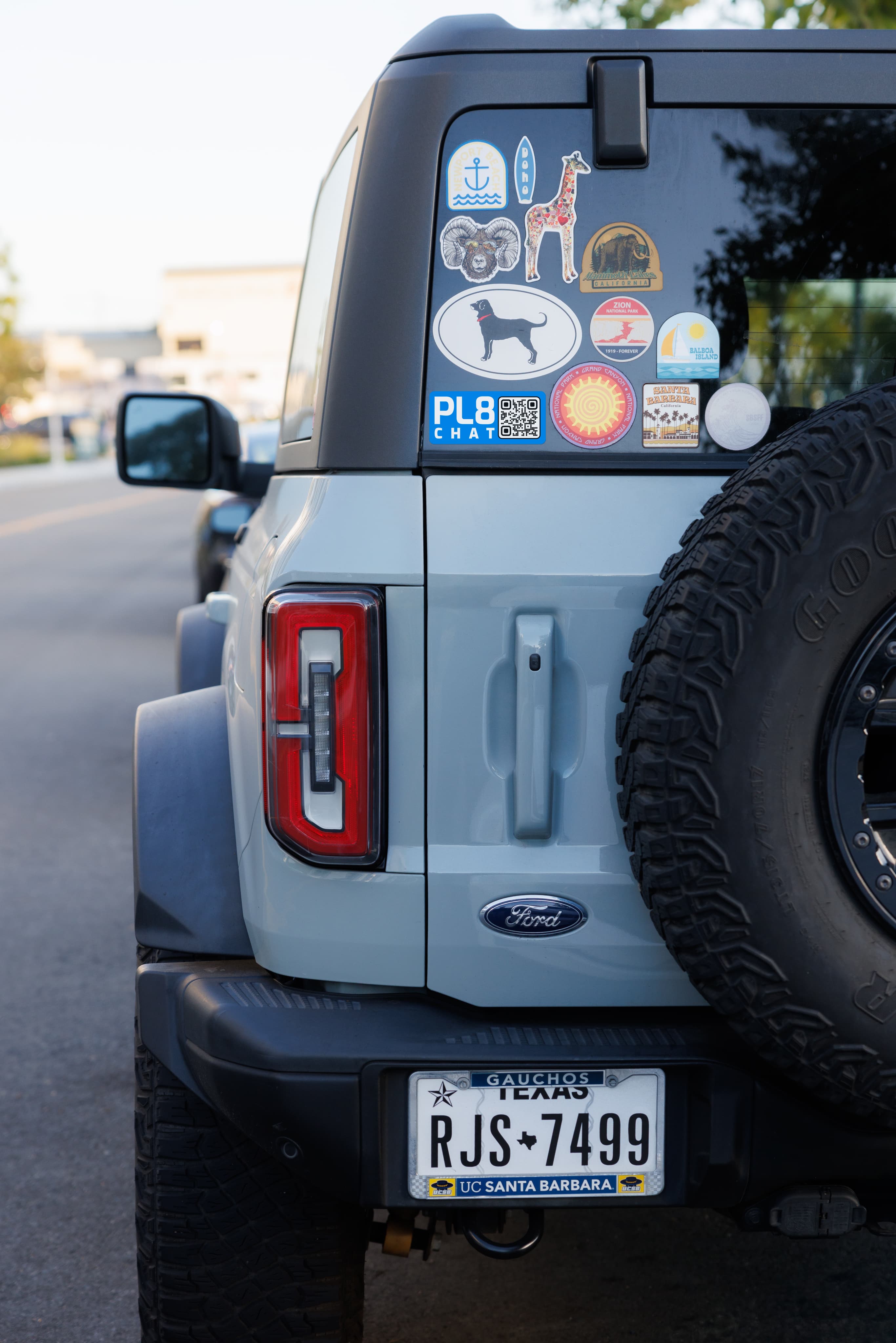 A driver standing next to a personal vehicle connected with PL8CHAT.
